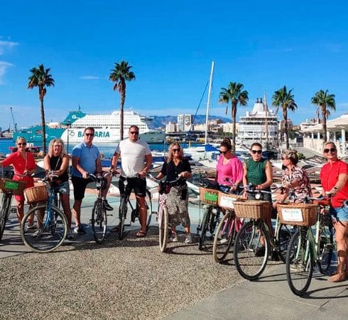 A group of people with rented bikes in Malaga, Spain