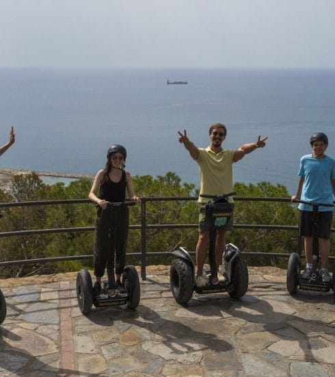 Photo showing group pf people pn Segways at top of Gibralfaro castle Malaga.