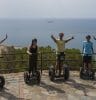 Photo showing group pf people pn Segways at top of Gibralfaro castle Malaga.