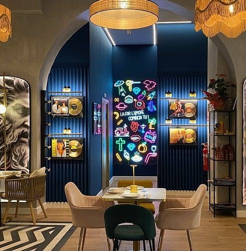 Image showing the interior of Bresca Italian restaurant Malaga. The decor is modern and colourful with a table set in the foreground.